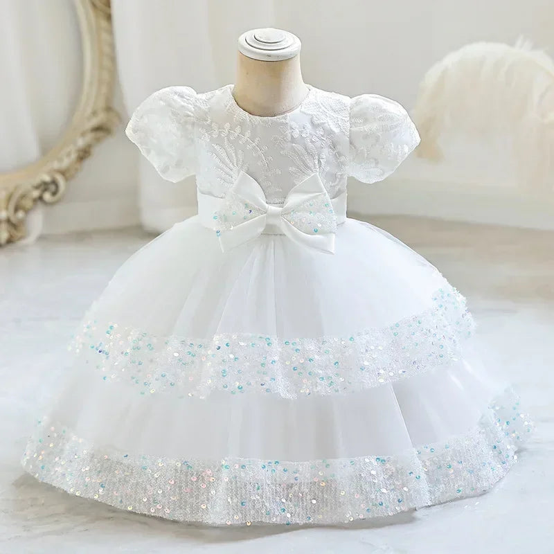 Fashion Bow Girls Party Dress Cotton Short Sleeve Kids Summer Bridesmaid Dress in white with puff sleeves and sequin details