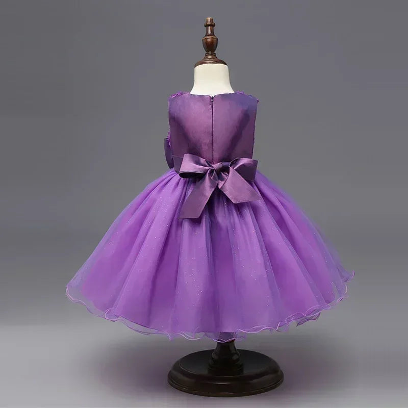 Purple sleeveless party dress with bow back on mannequin by Yamza Tots' Closet for girls