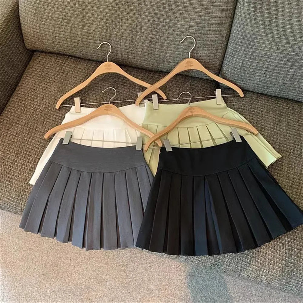 Fashion Girls Clothing Summer Casual Little Girls Solid Color High Waist Skirt in black gray white and yellow on hangers