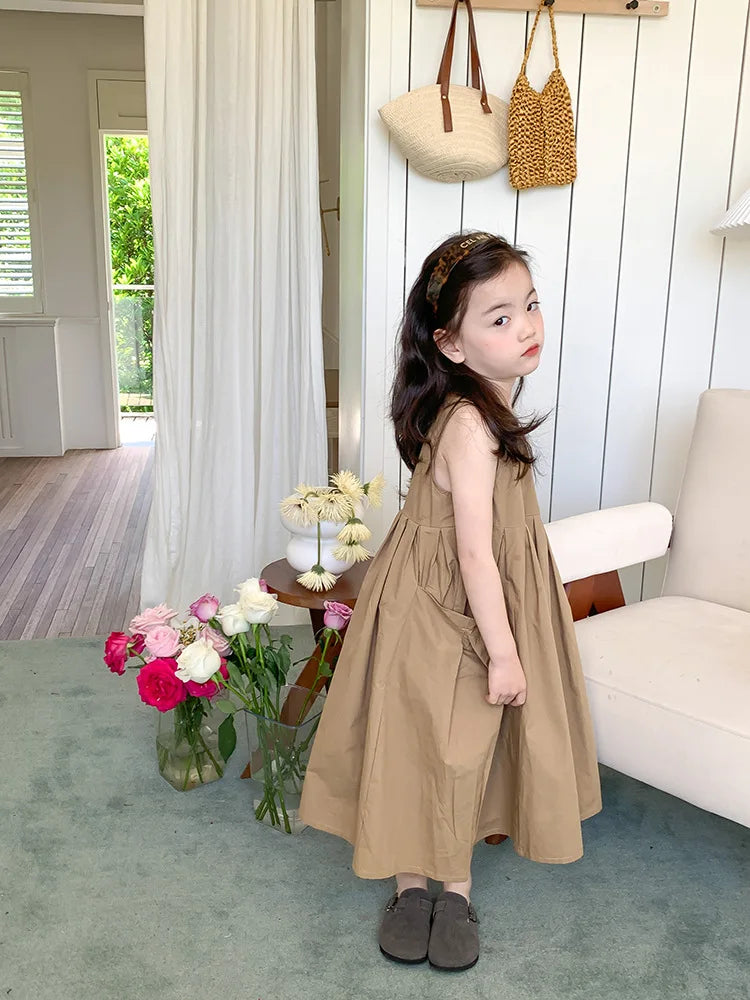 Fashion Girls Cotton Large Skirt Fairy Dress Summer Kids Sleeveless Korean Style in beige worn by a girl in a cozy living room