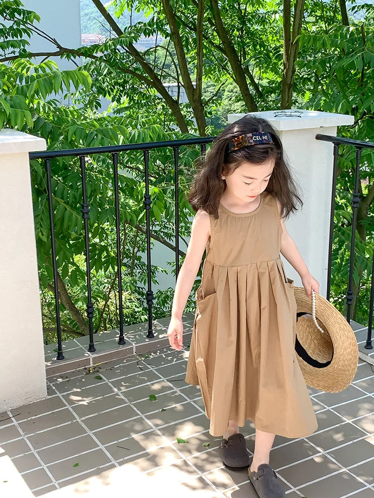 Fashion Girls Cotton Large Skirt Fairy Dress Summer Kids Sleeveless Korean Style worn by a girl holding a straw hat outdoors
