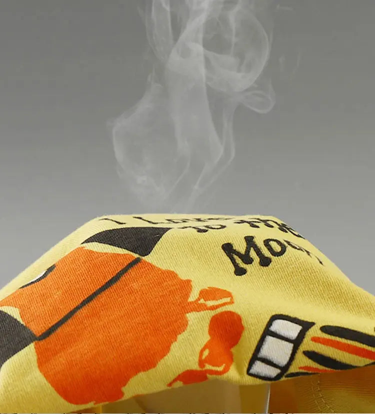 Close-up of yellow Fashion Kids Clothes Set Top Shorts 2PCS Cotton Soft Summer Suit with orange and black print