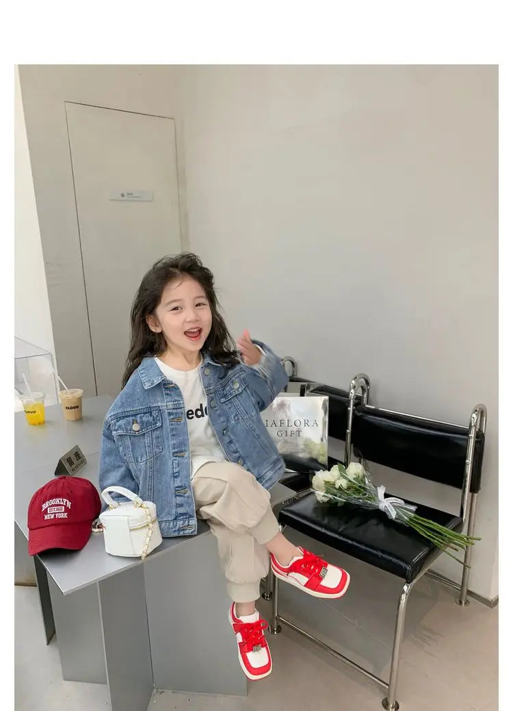 Fashion Kids Denim Jacket Girls Spring Autumn Casual Coat Children Outerwear worn by smiling girl sitting indoors with red shoes and white purse