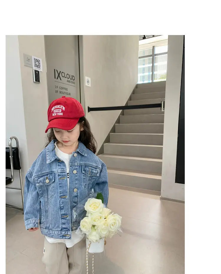 Fashion Kids Denim Jacket Girls Spring Autumn Casual Coat Children Outerwear worn by girl holding white flowers indoors