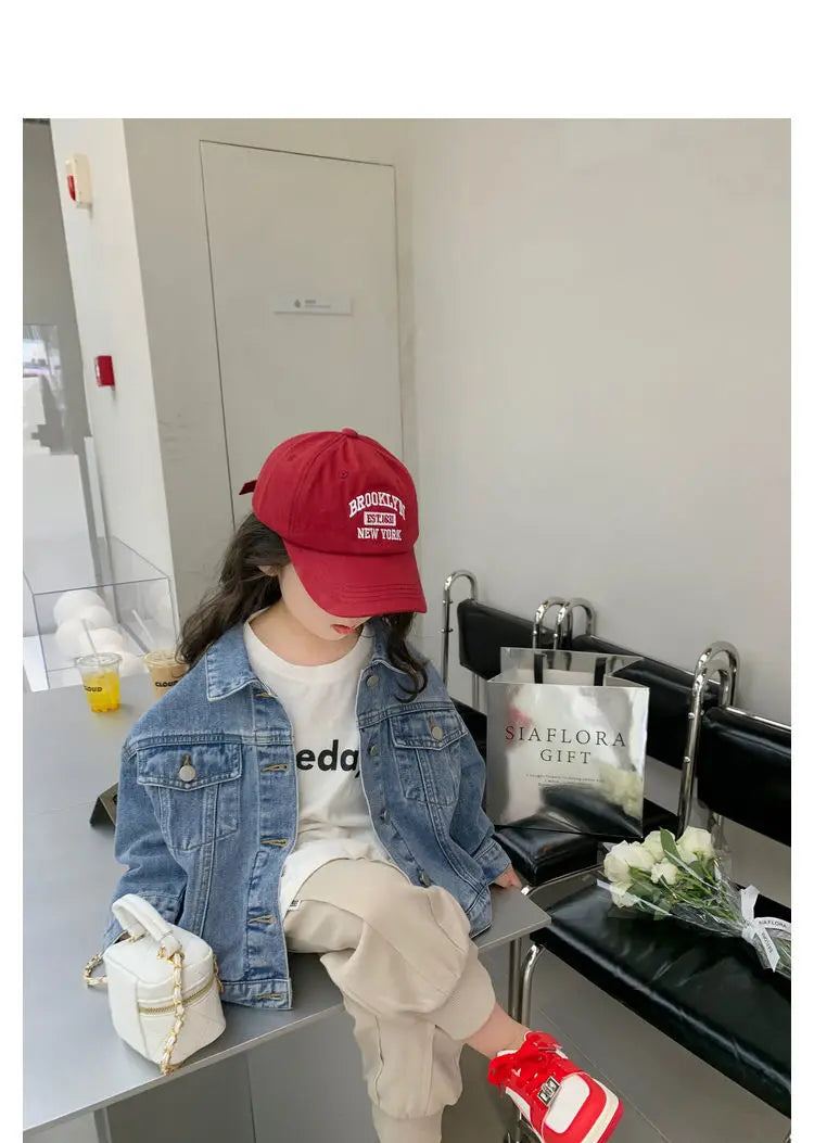 Fashion Kids Denim Jacket Girls Spring Autumn Casual Coat Children Outerwear modeled by child in red cap and casual outfit sitting indoors