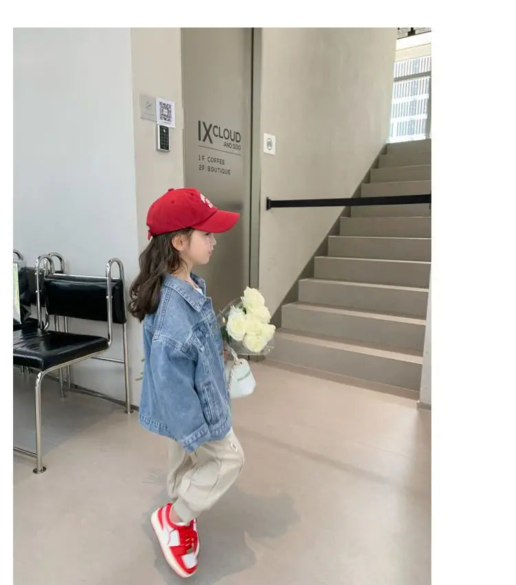 Fashion Kids Denim Jacket Girls Spring Autumn Casual Coat Children Outerwear worn by girl with red cap and red sneakers holding white flowers