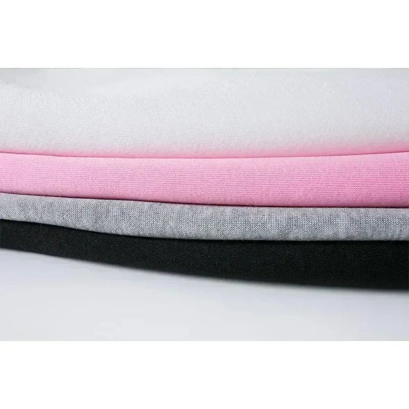 Stack of soft fabric layers in white, pink, gray, and black for Fashion Kids Hoodies Cute Tayo Cartoon Graphic Print Boys Girls Sweatshirt Tops