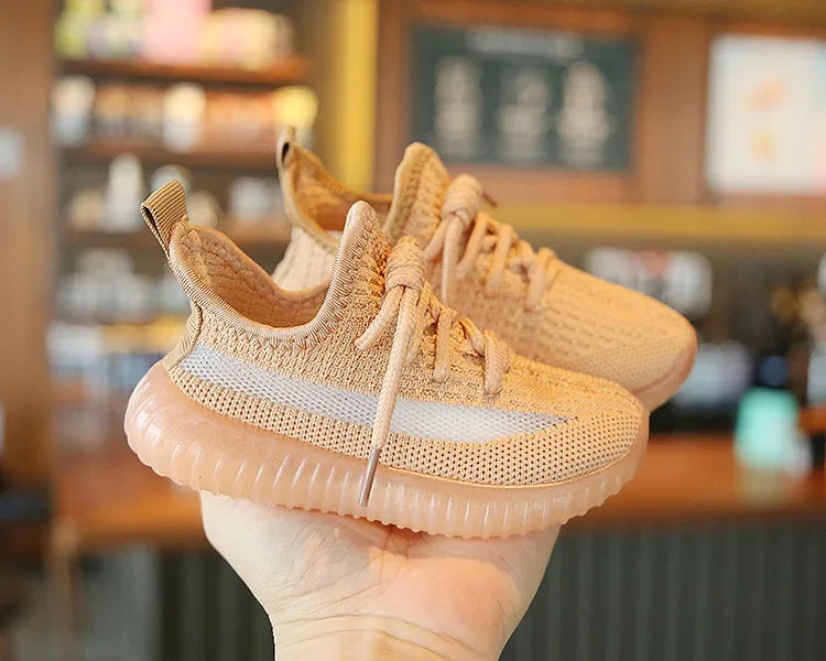 Yamza Tots Closet Fashion Kids Sneakers Breathable Non-slip Casual Running Shoes for Boys Girls in tan color held in hand