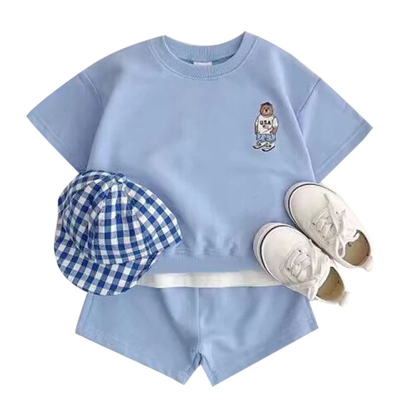 Fashion Kids Sports Bear Sweatshirt and Pants 2 Piece Fall Clothing Set in light blue with checkered hat and white sneakers