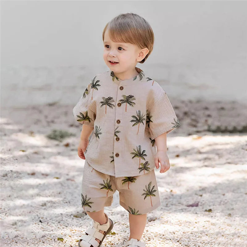 Fashion Kids Summer Casual Organic Cotton T-shirt and Shorts Set Toddler Outfit with palm tree print worn by toddler boy