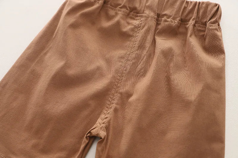 Close-up view of brown elastic waist shorts part of Fashion Summer Kids Cartoon T-Shirt and Denim Shorts 2PCS Casual Outfit Set