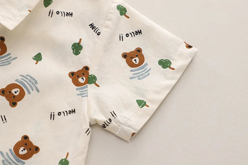 Fashion Summer Kids Cartoon T-Shirt and Denim Shorts 2PCS Casual Outfit Set featuring bear and tree prints on white fabric sleeve