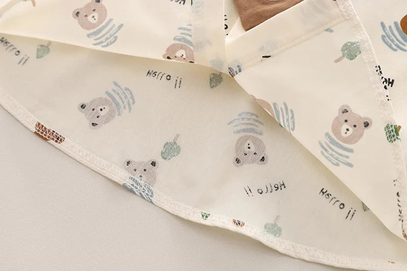 Close-up of fabric with bear and apple print from Fashion Summer Kids Cartoon T-Shirt and Denim Shorts 2PCS Casual Outfit Set