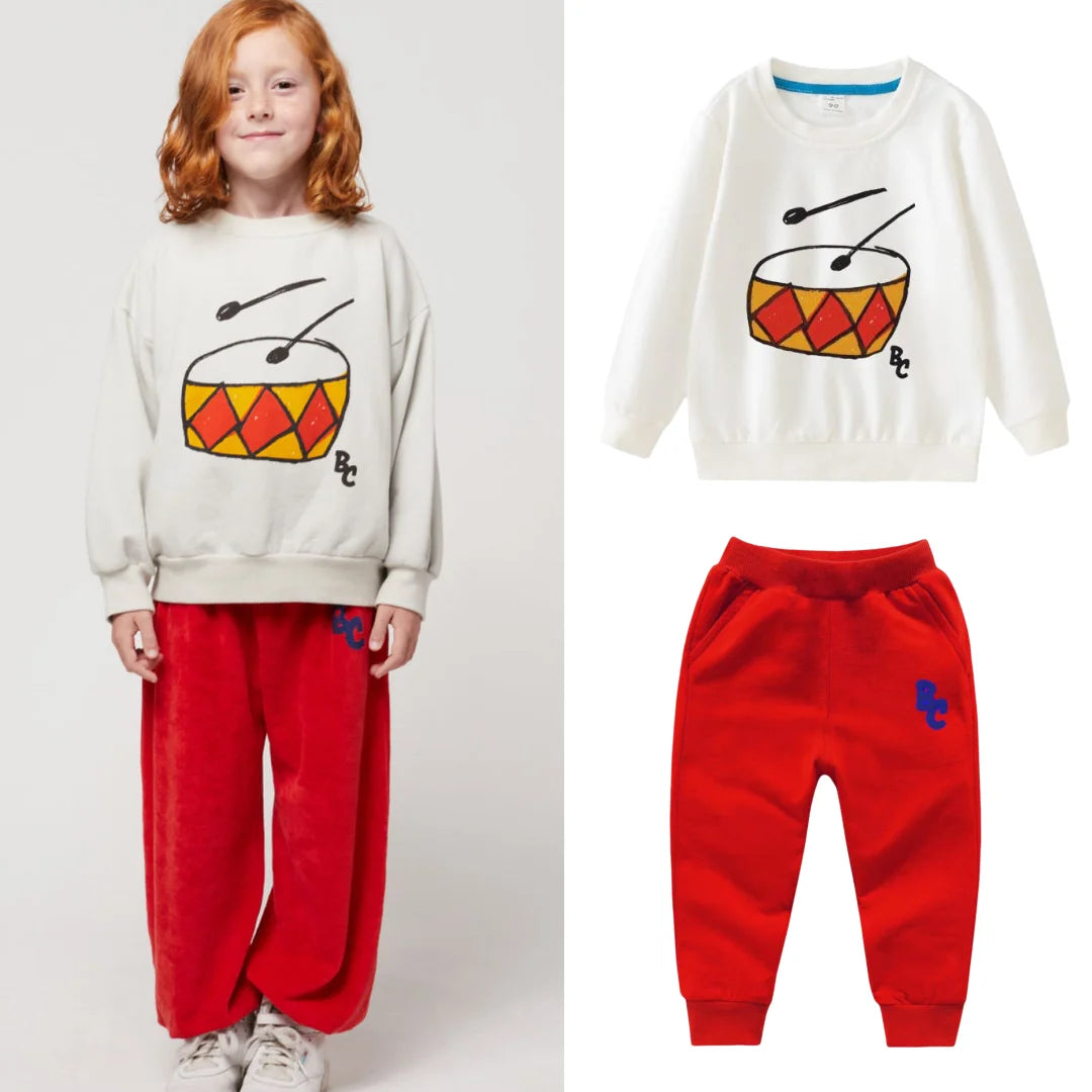 Full Sleeve Sweatshirts and Casual Pants Come with Fun Cartoon Designs featuring white sweatshirt with drum graphic and red pants
