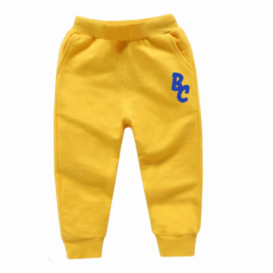 Yellow casual pants for kids with BC logo designed by Yamza Tots' Closet Full Sleeve Sweatshirts and Casual Pants Come with Fun Cartoon Designs