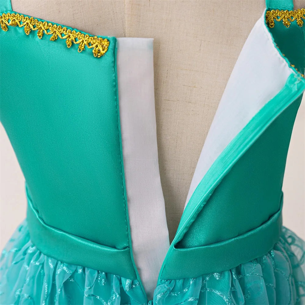 Close-up of turquoise Girl Fashion Party Dress Exotic Sequin Beaded Tulle Tutu Gown Kids Holiday Wear with gold trim