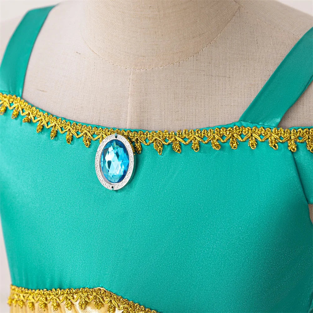 Close-up of green Girl Fashion Party Dress Exotic Sequin Beaded Tulle Tutu Gown Kids Holiday Wear with blue gem and gold trim