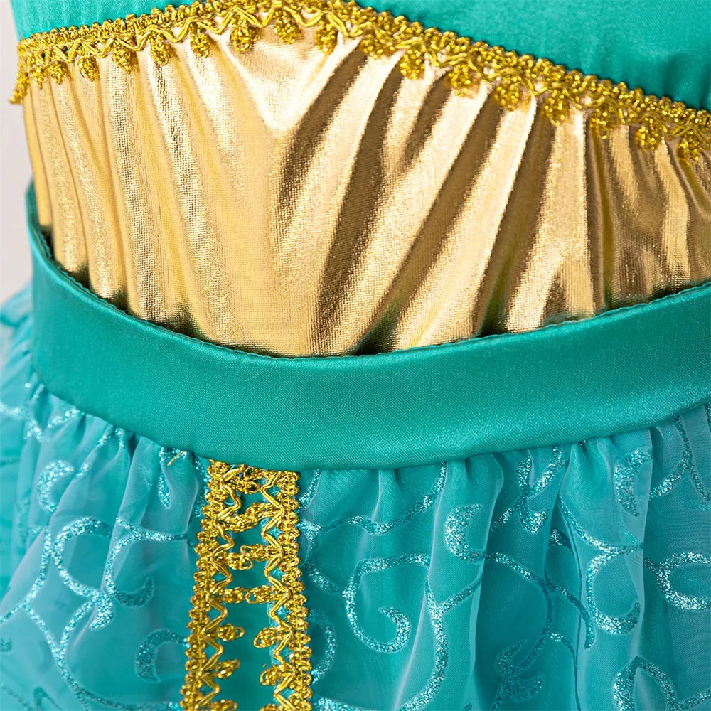 Close-up of Girl Fashion Party Dress Exotic Sequin Beaded Tulle Tutu Gown Kids Holiday Wear with gold and turquoise detailing