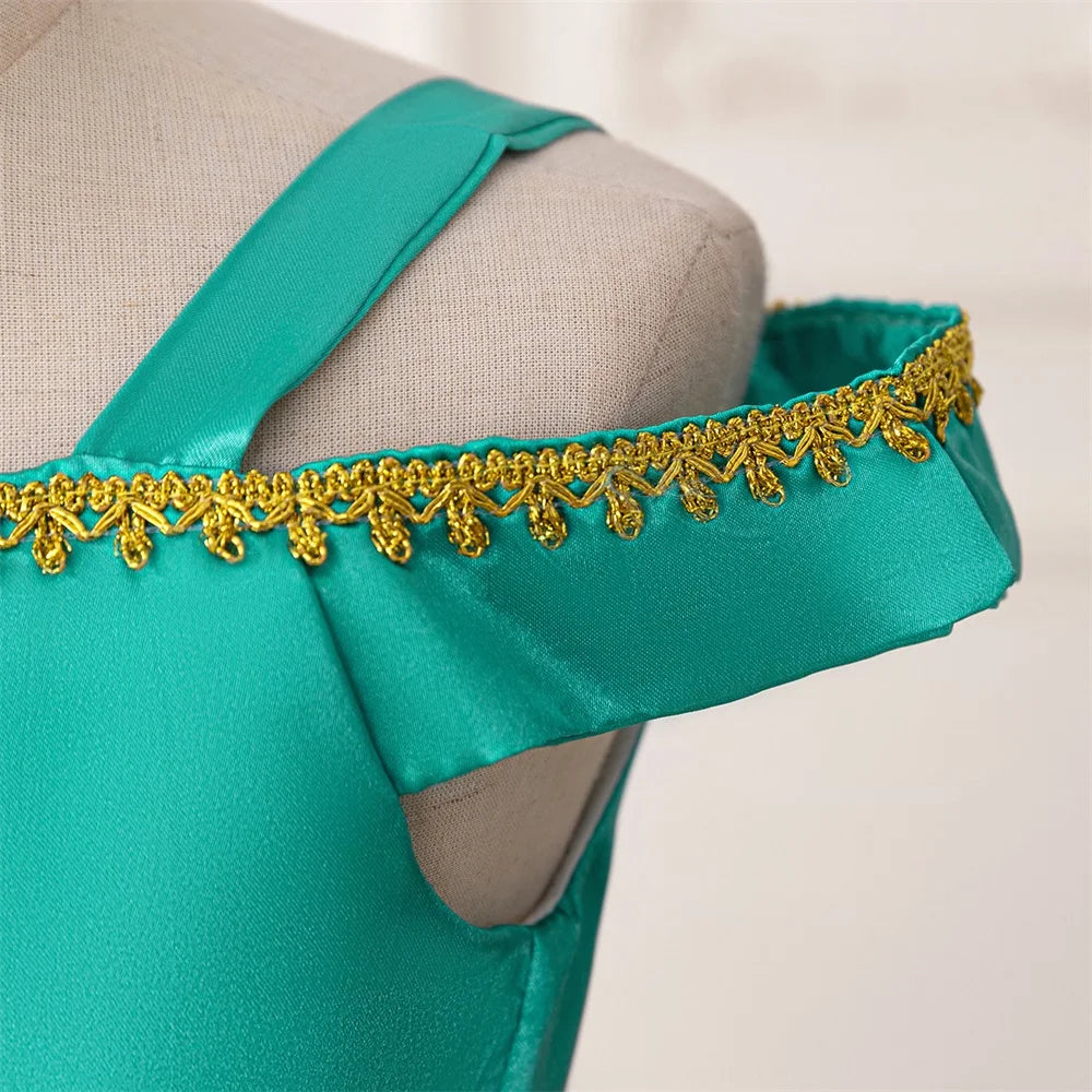Close-up of teal Girl Fashion Party Dress Exotic Sequin Beaded Tulle Tutu Gown Kids Holiday Wear with gold trim on shoulder