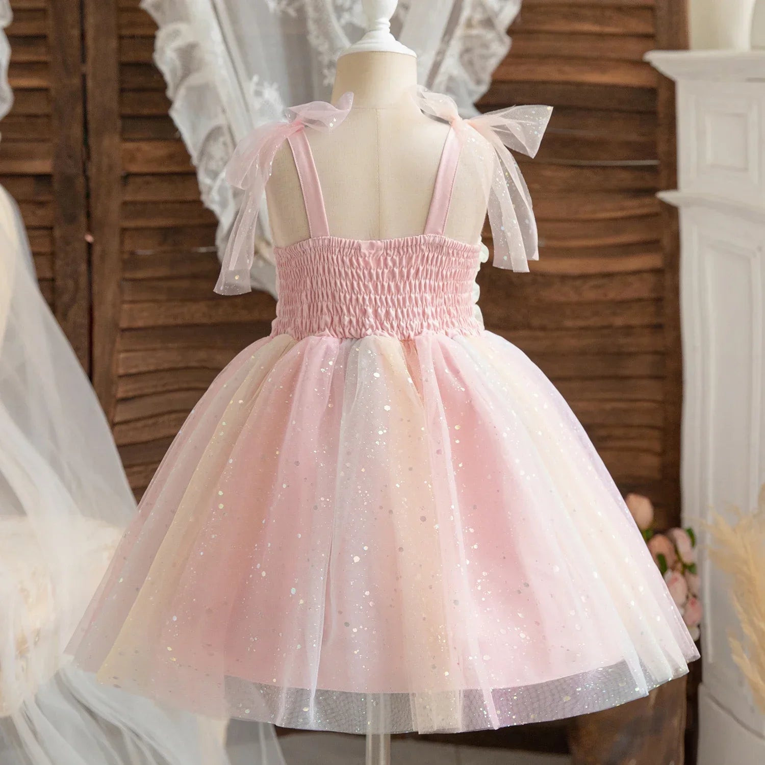 Girl Rainbow Sequins Tulle Birthday Party dress in pastel pink with sparkly details and bow straps