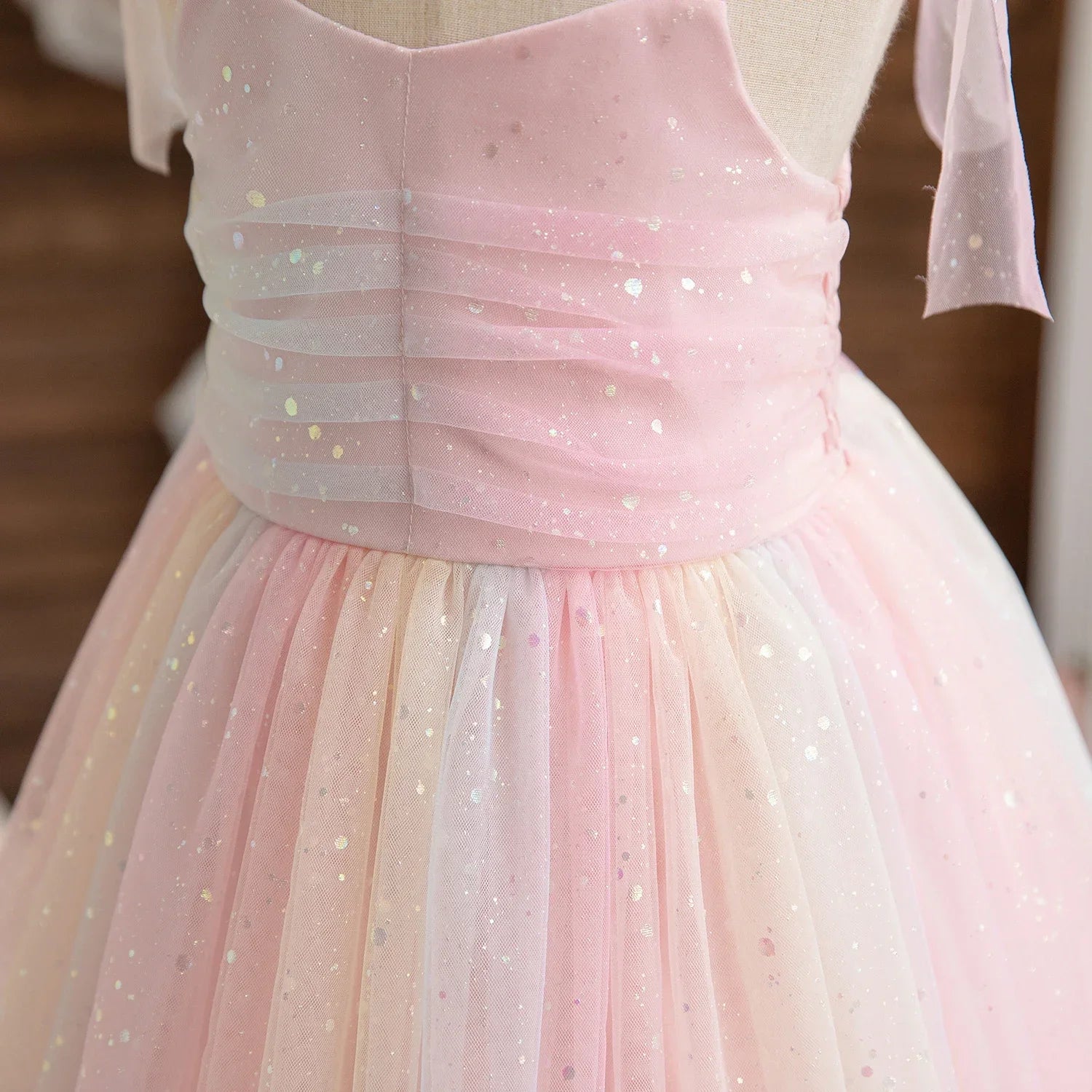 Close-up of pink Girl Rainbow Sequins Tulle Birthday Party dress with sparkling sequin details