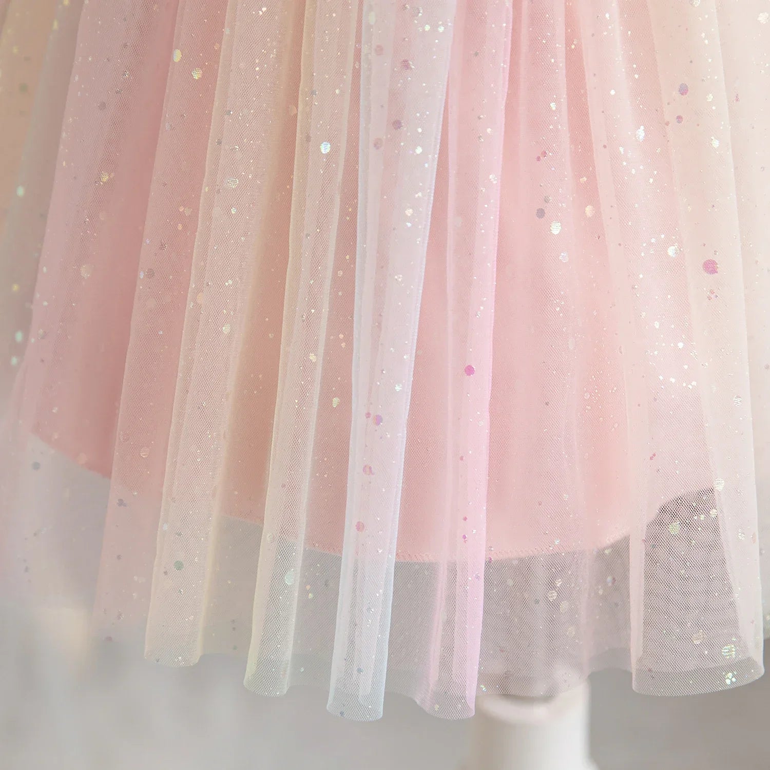 Close-up of pink Girl Rainbow Sequins Tulle Birthday Party dress with sparkly sequins and soft layers