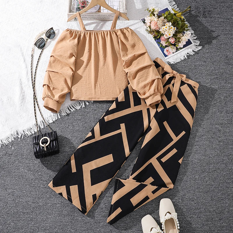 Girls Khaki Off-Shoulder Top & Striped Pants Set summer resort outfit laid flat with sunglasses and shoes