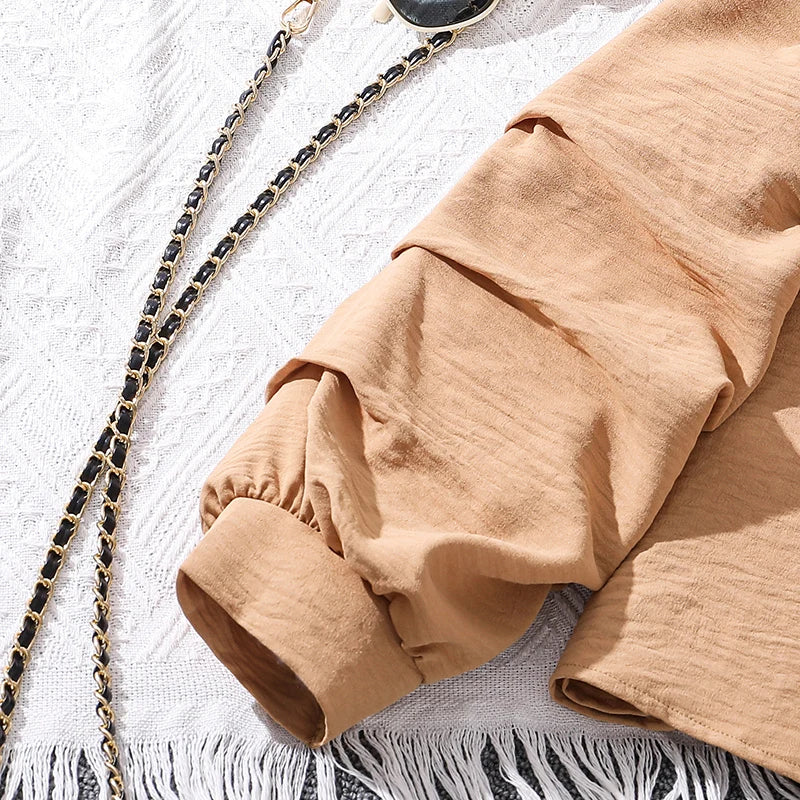Girls Khaki Off-Shoulder Top & Striped Pants Set summer resort outfit sleeve detail on white textured fabric