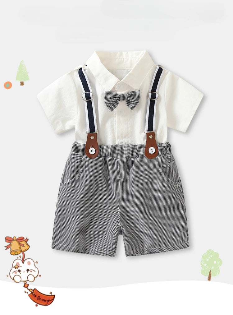 Boys white short sleeve shirt and shorts two-piece summer party outfit with suspenders and bow tie