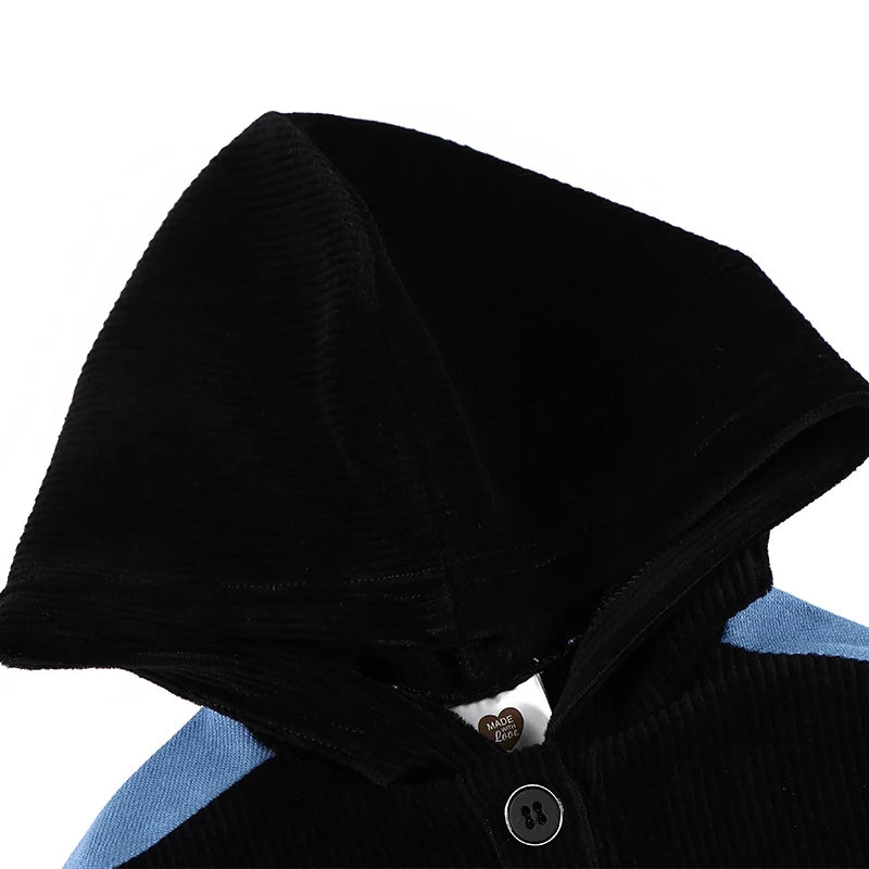 Kids Black Corduroy Hoodie Dress with Denim Side Panel and Kangaroo Pocket close-up of black corduroy hood and blue denim side panel