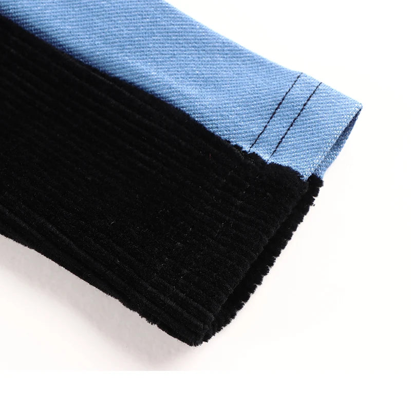 Close-up of Kids Black Corduroy Hoodie Dress with Denim Side Panel and Kangaroo Pocket sleeve detail
