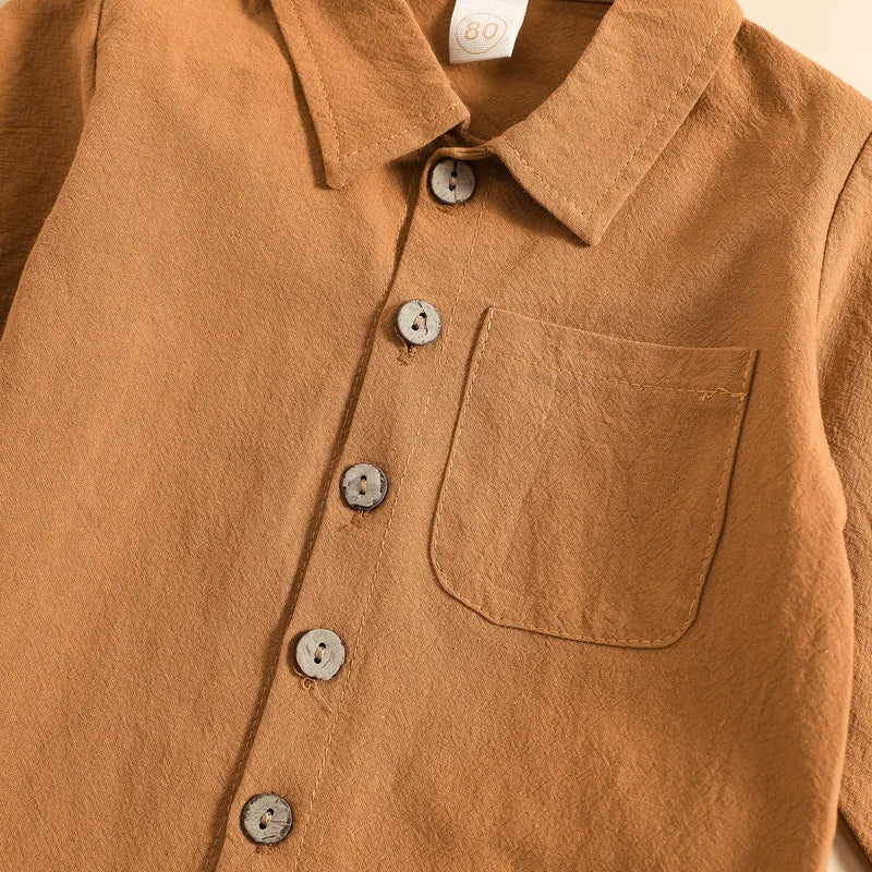 Close-up of Kids Boy Autumn Pant Sets Solid Color Long Sleeve Shirt with buttons and chest pocket in brown