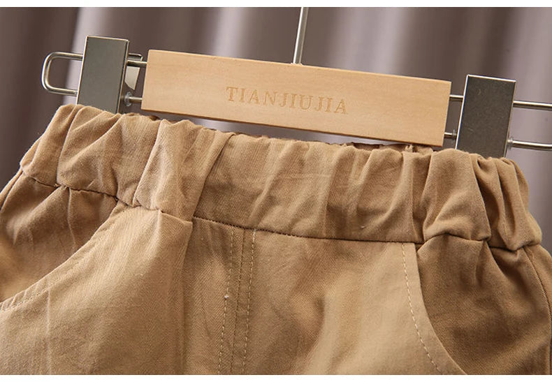 Close-up of beige toddler pants with elastic waistband from Kids Boys Cartoon Clothing Set Baby T-Shirt Pants Toddler T-shirt Shorts Outfit