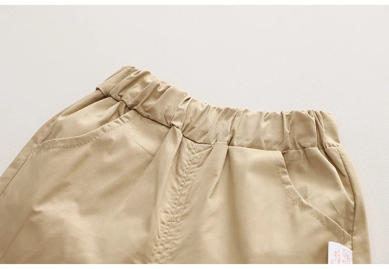 Close-up of beige elastic waist pants pocket from Kids Boys Cartoon Clothing Sets Baby Tee Shirt Pants Toddler T-shirt Shorts Outfit
