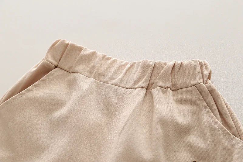 Close-up of beige elastic waistband shorts from Kids Boys Summer Cotton Clothes Bear Print Tie Shirt Shorts 2PCS Toddler Set