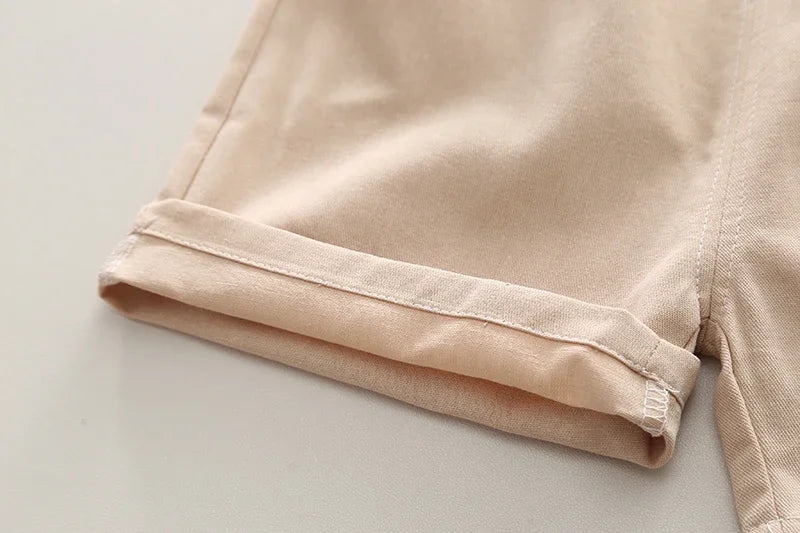 Close-up of beige shorts hem from Kids Boys Summer Cotton Clothes Bear Print Tie Shirt Shorts 2PCS Toddler Set