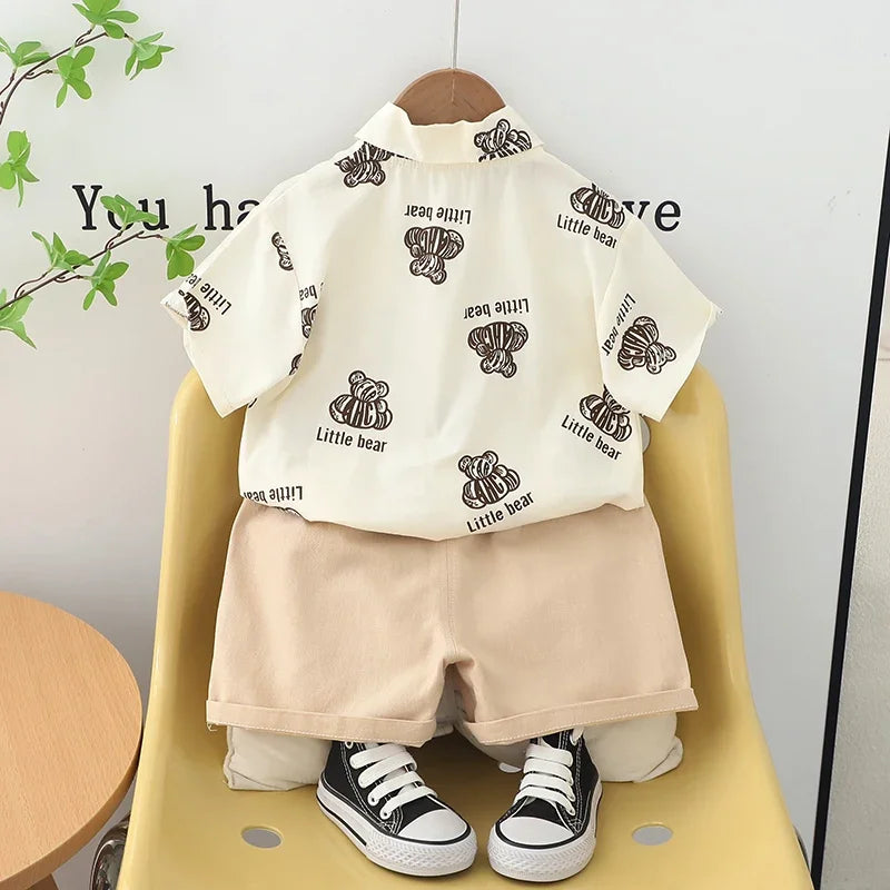 Kids Boys Summer Cotton Clothes Bear Print Tie Shirt Shorts 2PCS Toddler Set displayed on a yellow chair