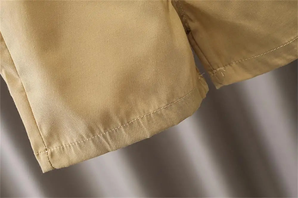 Close-up view of beige shorts hem from Kids Boys Summer Two-Piece Set New Baby Outfit Trendy Casual Fashion Clothing