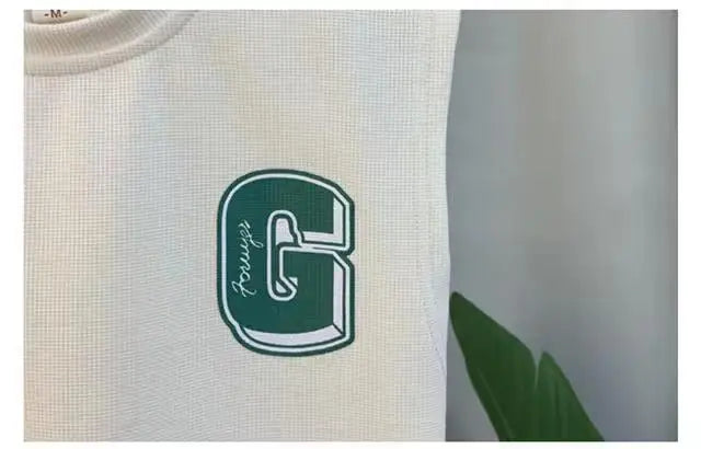 Close-up of white vest with green letter G print from Kids Boys Summer Vest Set New Fashion Baby Net Red Clothes Two Piece Outfits