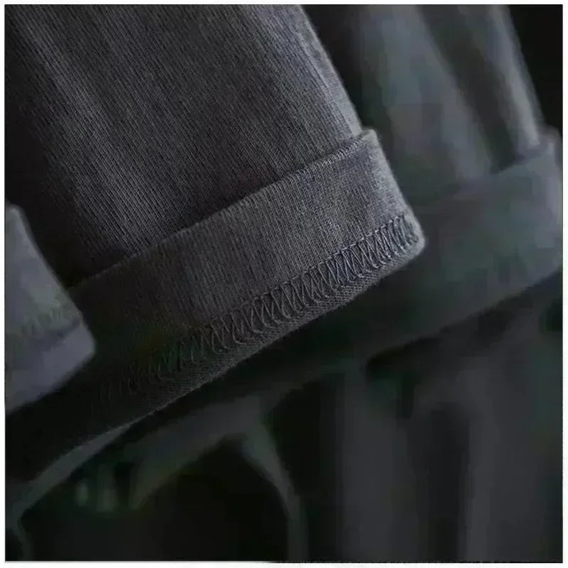 Close-up of black cotton fabric sleeve detail for Kids Cartoon Print Cotton T-shirt Streetwear Style Short Sleeve Top Unisex