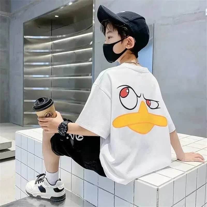 Kids Cartoon Print Cotton T-shirt Streetwear Style Short Sleeve Top Unisex worn by child sitting with coffee cup