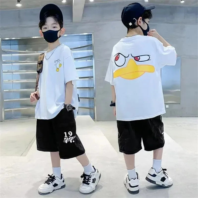 Kids Cartoon Print Cotton T-shirt Streetwear Style Short Sleeve Top Unisex worn by child in black shorts and sneakers
