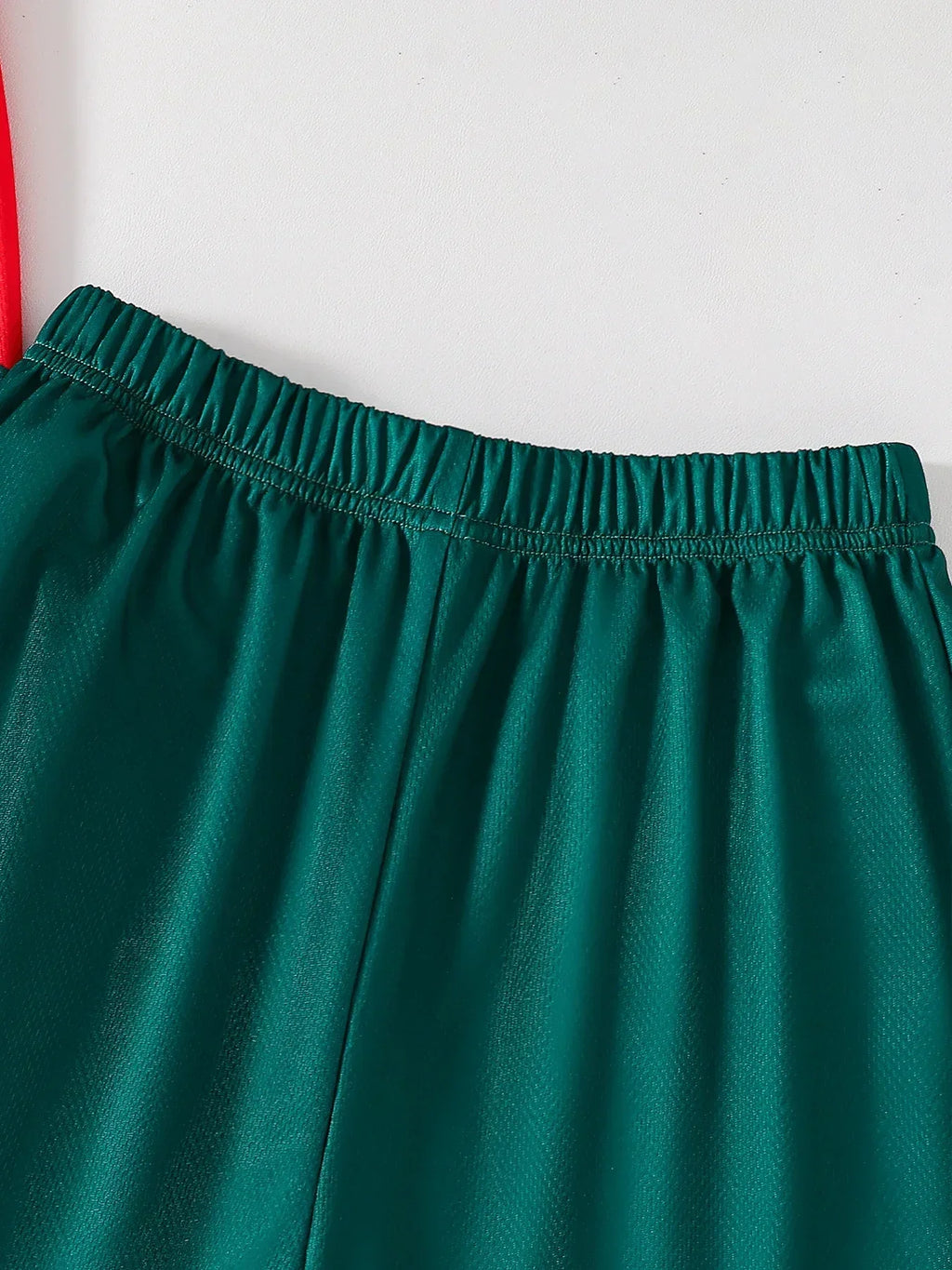 Close-up of green elastic waistband shorts from Kids' Fall Boys' Fashion Quick-Dry T-Shirt and Shorts Two-Piece Outfit by Yamza Tots' Closet