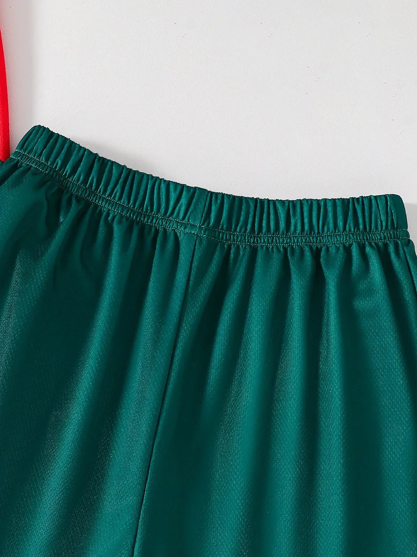 Close-up of green elastic waistband shorts from Kids' Fall Boys' Fashion Quick-Dry T-Shirt and Shorts Two-Piece Outfit by Yamza Tots' Closet