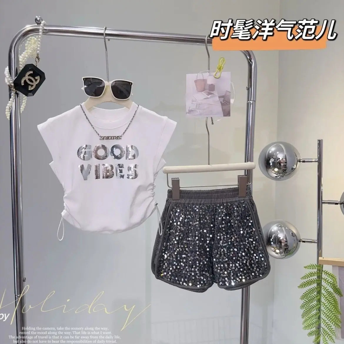 Kids Girls Summer Outfit Set Sleeveless T-shirt and Shiny Shorts 2-Piece Set by Yamza Tots' Closet hanging with sunglasses on rack