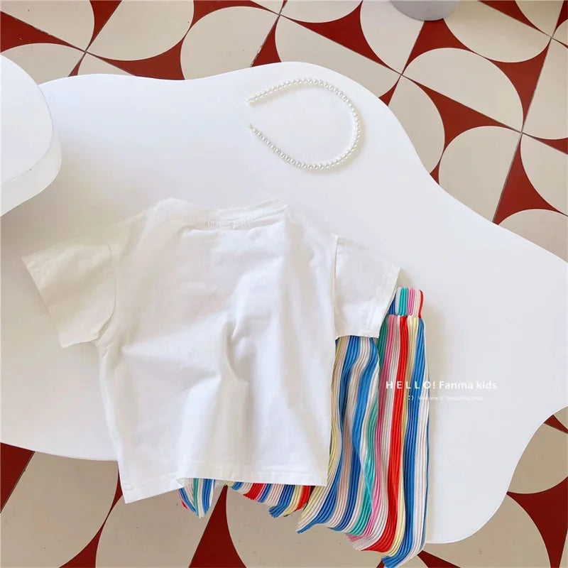 Kids Girls Summer Outfit Set with Short Sleeve T-Shirt and Rainbow Pants laid flat on white table with pearl headband