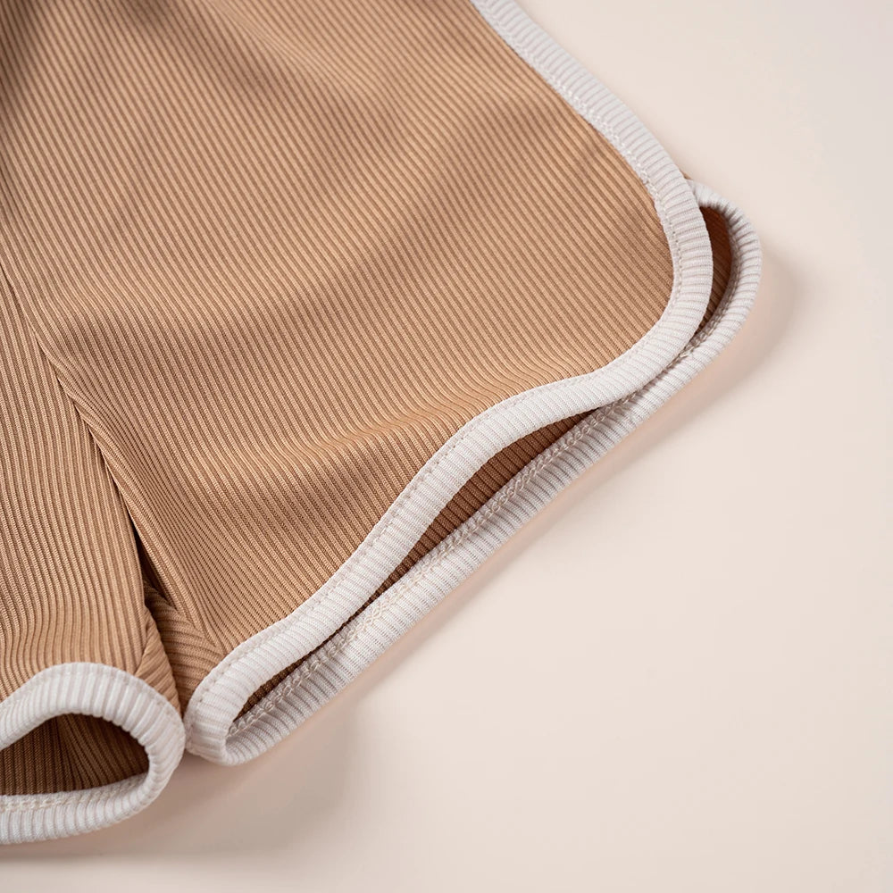 Close-up of brown ribbed kids shorts with white trim from Kids Summer Fashion 2pcs Casual Printed Unisex T-Shirt and Shorts Set