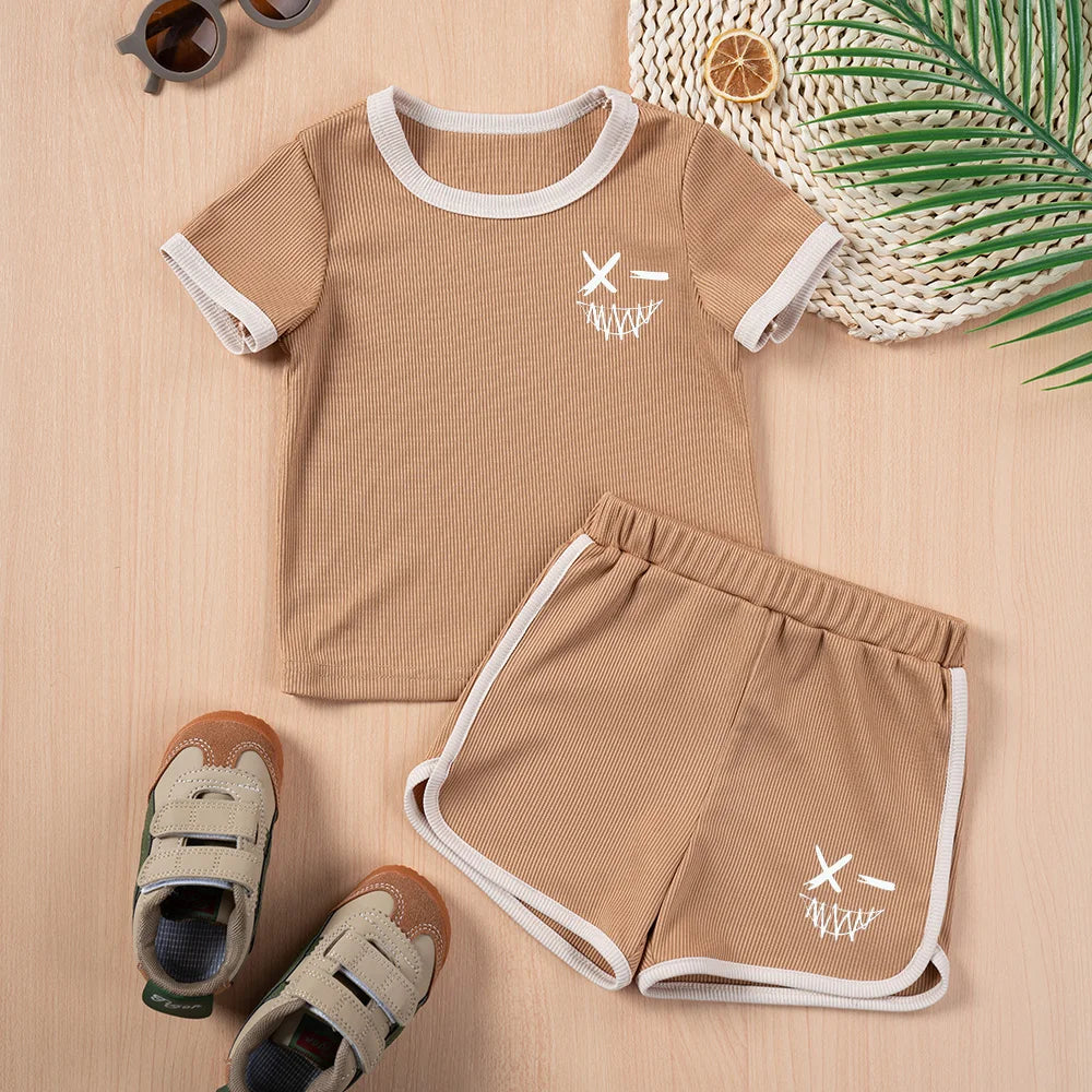 Kids Summer Fashion 2pcs Casual Printed Unisex T-Shirt and Shorts Set in beige with white trim and graphic design