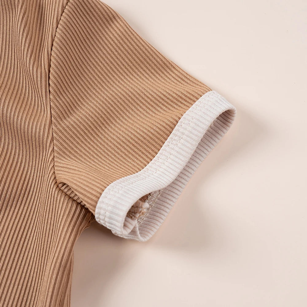 Close-up of ribbed sleeve on kids summer fashion 2pcs casual printed unisex t-shirt and shorts set