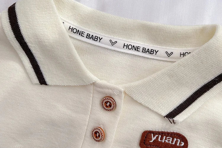 Kids Summer Short-sleeve Polo Shirt Bear & Striped Shorts Baby Boy Set close-up of white polo collar with brown stripes and buttons